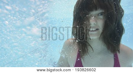 little girl swimming in pool - underwather photo