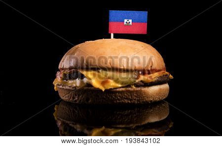 Haitian Flag On Top Of Hamburger Isolated On Black Background