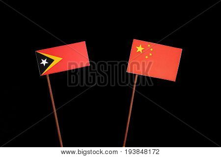East Timorese Flag With Chinese Flag Isolated On Black Background