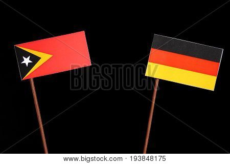 East Timorese Flag With German Flag Isolated On Black Background