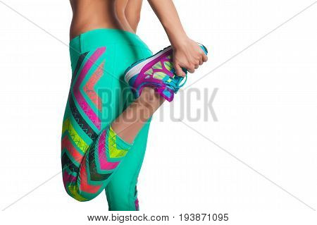 young fitness woman stretching legs before run