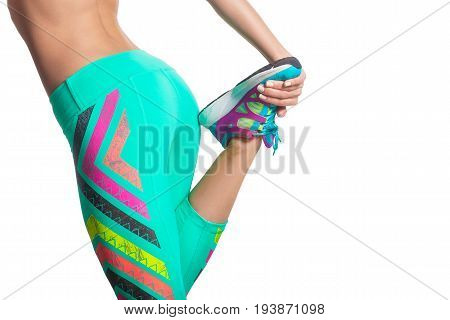 young fitness woman stretching legs before run