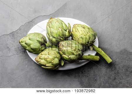Fresh Artichoke On White Plate. Harvest Concept. Copy Space