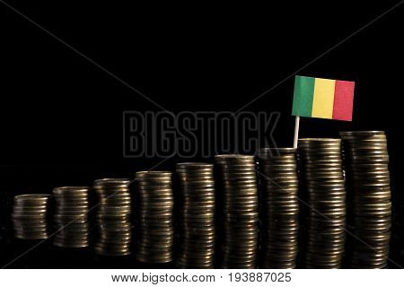 Malian Flag With Lot Of Coins Isolated On Black Background