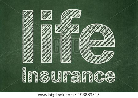 Insurance concept: text Life Insurance on Green chalkboard background
