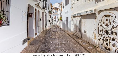 Panorama Of A Coblestoned Street In Altea