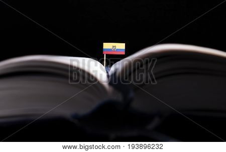 Ecuadorean Flag In The Middle Of The Book. Knowledge And Education Concept.