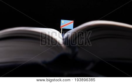 Democratic Republic Of The Congo Flag In The Middle Of The Book. Knowledge And Education Concept.