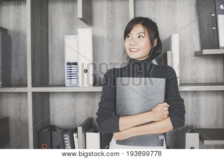 Asian Woman Holding Document At Working Place Woman Working Concept Vintage Tone.