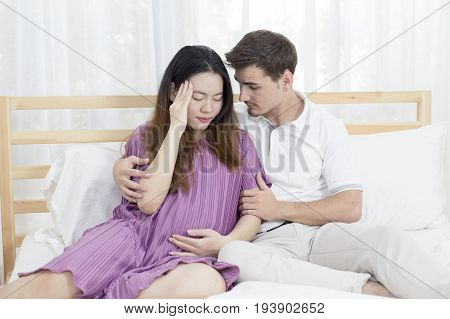 Man Help Pregnant Woman When She Feel Headache In Bedroom Man And Woman With Family Concept 2 Person