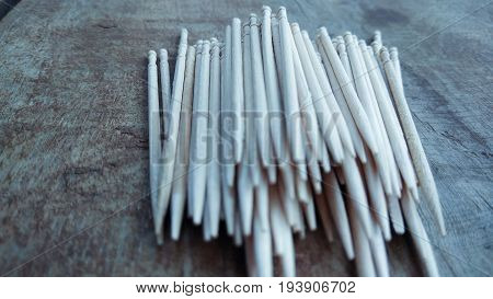 tooth picks abstract composition on wood background