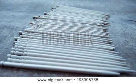 tooth picks abstract composition on wood background
