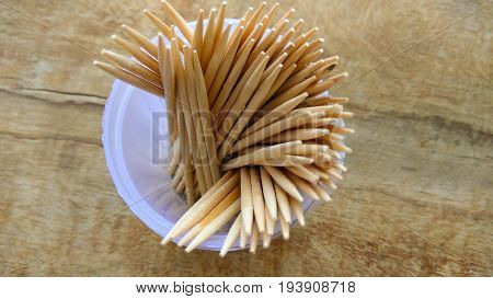 abstract wooden tooth picks on wood background