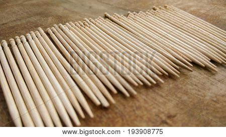 tooth picks abstract composition background in wood