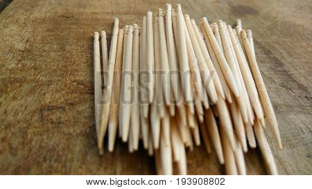 tooth picks abstract composition background in wood