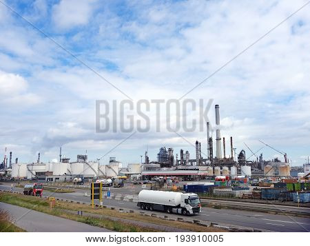 antwerpen Belgium 26 june 2017: tank trucks pass esso refinery in belgian port of antwerp