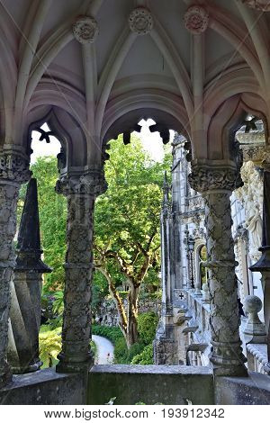 SINTRA, PORTUGAL - JUNE 6 2017: Palace Quinta da Regaleira Sintra Portugal. Palace with symbols related to alchemy Masonry the Knights Templar and the Rosicrucians shown at sunset. Masterpiece of Neo-Manueline architecture style