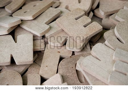 Wooden letters of the English alphabet for sale in the wood shop. Alphabet made of wooden letters for learning and education concept