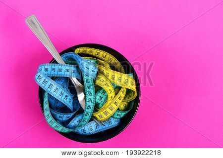 Plate Full Of Measuring Tapes Of Different Colors