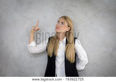 Young asian women showhand for pointing something with wonder emotion.