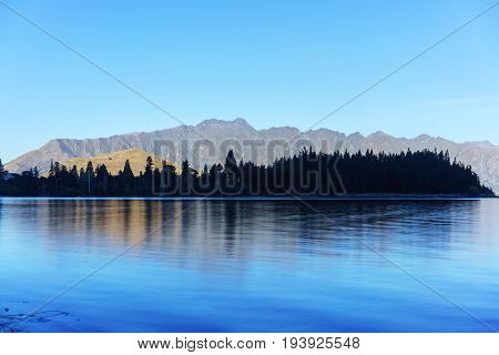 Beautiful serenity of Lake Wakatipu in Queenstown in Autumn South Island of New Zealand