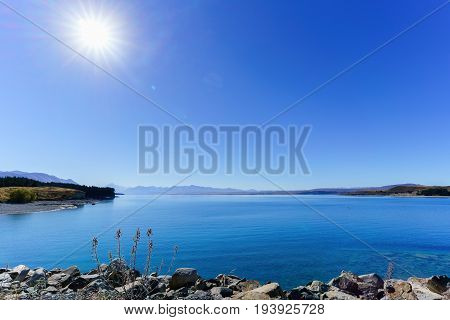 Beautiful backlit scenery of Lake Pukaki Mackenzie District Canterbury region South Island of New Zealand