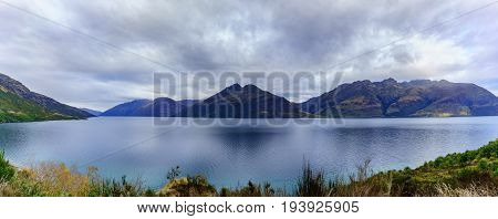 Panoramic serenity of beautiful Lake Wakatipu in Autumn Queenstown South Island of New Zealand