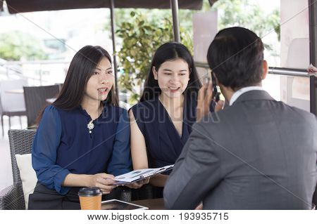 Beautiful Asian Woman Working With Team For Outdoor Business Discussion Business Discussion Concept.