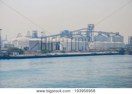 The oil tank is located near the port. In order to ship the oil to the ship.