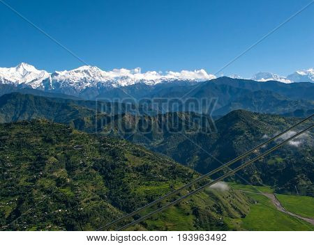 POKHARA, NEPAL. Flight on a hang glider (deltaplan). Shooting Pokhara and Green rice terraces of the Himalayas from the height of bird flight.