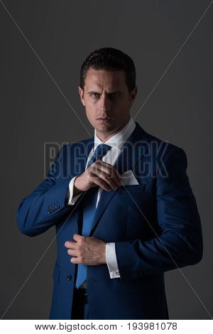 Businessman Smiling With Business Or Bank Card In Pocket