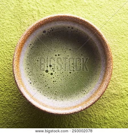 Top View Of Green Tea Matcha In A Bowl On A Powdered Surface