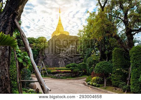 Golden Pagoda Sculpture And Stone Carving At Wat Tham Pha Daen At Sakon Nakhon,thailand.