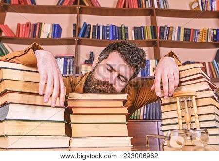 Teacher Or Student With Beard Fall Asleep On Books, Defocused. Man On Sleeping Face Lay Between Pile