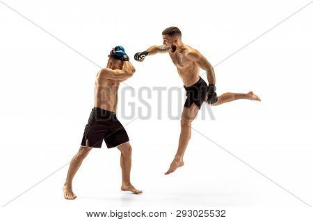 Mma. Two Professional Fightesr Punching Or Boxing Isolated On White Studio Background. Couple Of Fit