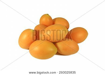 Pile Of Vibrant Yellow Fresh Ripe Marian Plums Isolated On White Background