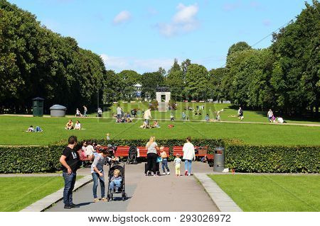 Oslo, Norway - August 2, 2015: People Visit Gardens And Vigeland Installation In Frogner Park, Oslo.