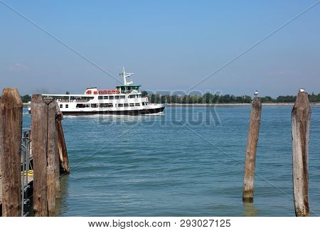 Boat For Tourist Called Vaporetto In Italian Language In The Venetian Lagoon In Italy Near Venice