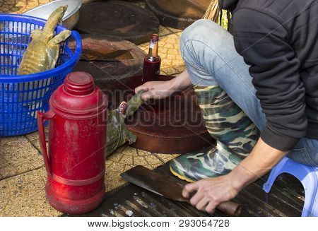 Hanoi, Vientam - January 04, 2017: Man Killing A Turtle At Market In Hanoi, Vietnam. Turtles Are A T