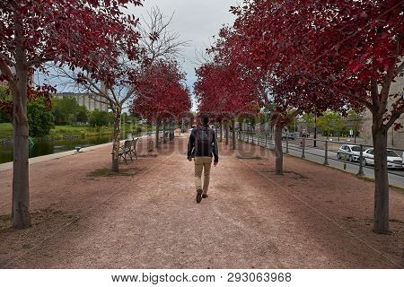 Montreal, Quebec, Canada September 29, 2018: Tourist Walks Along The Avenue Along The Lachine Canal,
