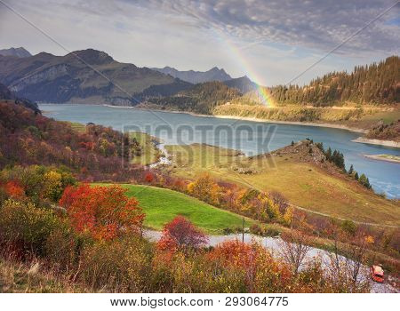 Aerial Morning View Of Roselend Lake/lac De Roselend. Picturesque Autumn Scene Of Auvergne-rhone-alp