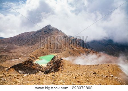 Hikers at Tongariro Alpine Crossing tramping track, one of the most popular day hikes in New Zealand. Track crossing the Tongariro National Park, the oldest national park North Island of New Zealand