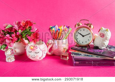 Different Notebooks, Alarm Clock, Unicorn Mug, Llama Squishy, And Flamingo Mug With Colorful Gel Pen