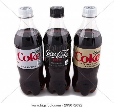 Bottles Of Diet Coke, Coke Zero And Caffeine Free Coke On White Background