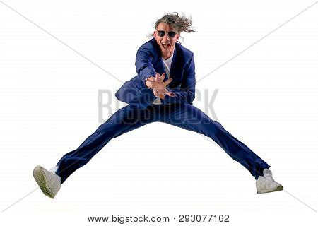 Confident Smart Looking Man Laughing And Jumping Up, Enjoying His Success - Wearing Siut, Isolated O