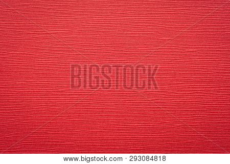Japanese red linen washi paper with an embossed linear groove texture