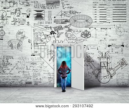 Woman Standing In Front Of A Wall Drawn With Math Formlas And Problems. Space Behind The Opened Door