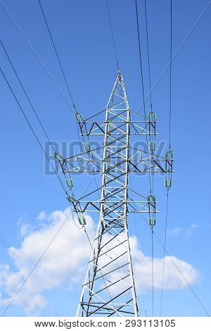High-voltage Supports With A View Of The Blue Sky