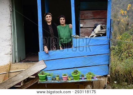 Lasak, Iran - November 22, 2018 Close Up Portrait Of Two Elderly Woman In Front Of Balcony. Gilan Pr