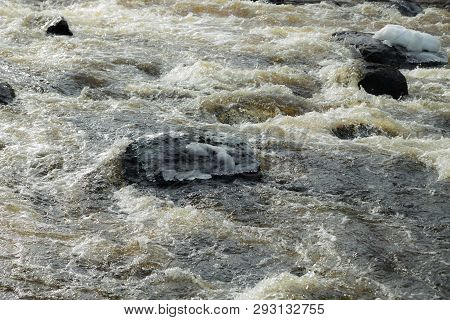 Rough River Jokelanjoki And Stones In Water, Kouvola, Finland.
